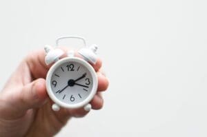 Tiny white alarm clock